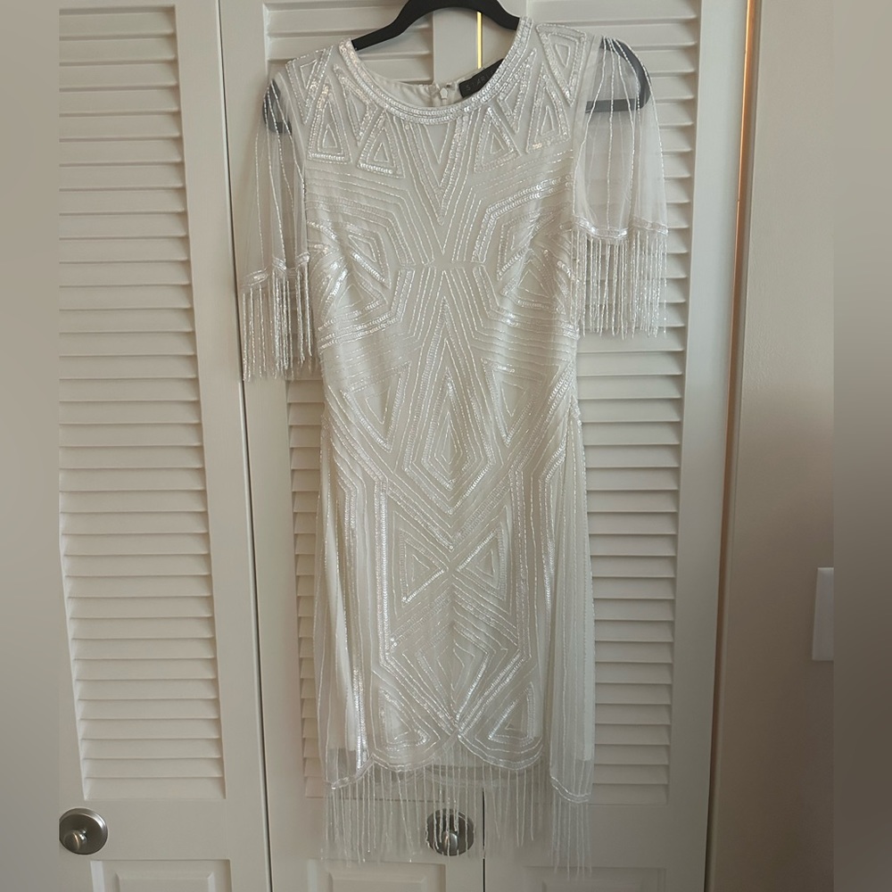 Fun and flirty ivory cocktail dress